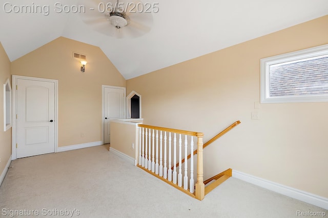 10611 Lighthouse Pt, South Lyon, MI 48178 - hall with carpet floors, an upstairs landing, vaulted ceiling, and baseboards