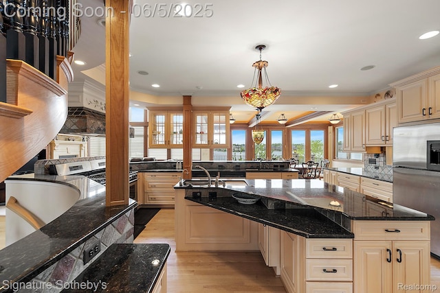 10611 Lighthouse Pt, South Lyon, MI 48178 - kitchen with stainless steel refrigerator with ice dispenser, ornamental molding, cream cabinets, light wood-style floors, and backsplash