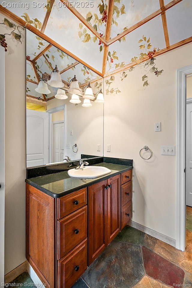 10611 Lighthouse Pt, South Lyon, MI 48178 - bathroom with baseboards, vanity, and stone finish flooring