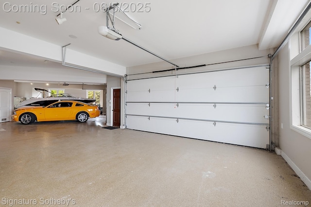 10611 Lighthouse Pt, South Lyon, MI 48178 - garage featuring a garage door opener