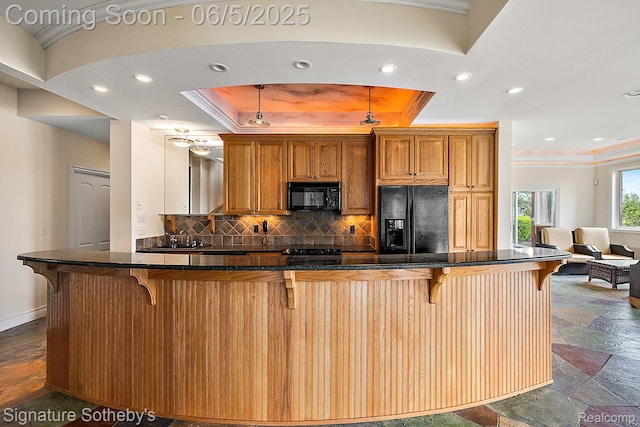 10611 Lighthouse Pt, South Lyon, MI 48178 - kitchen with black appliances, crown molding, tasteful backsplash, a kitchen breakfast bar, and stone tile floors
