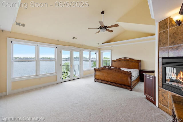 10611 Lighthouse Pt, South Lyon, MI 48178 - bedroom with light colored carpet, access to outside, a water view, baseboards, and a tiled fireplace