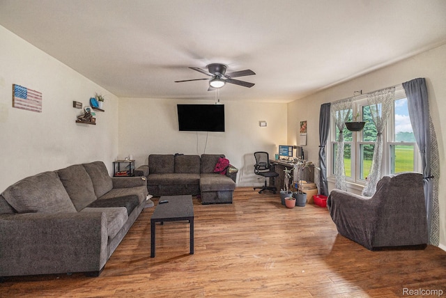 7184 Grand River Rd, Bancroft, MI 48414 - living area featuring wood finished floors and ceiling fan