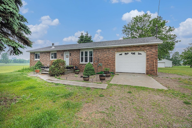 7184 Grand River Rd, Bancroft, MI 48414 - single story home with a garage, a front lawn, driveway, and brick siding