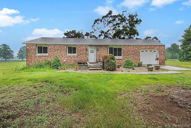 7184 Grand River Rd, Bancroft, MI 48414 - ranch-style house featuring an attached garage, brick siding, a front lawn, and driveway