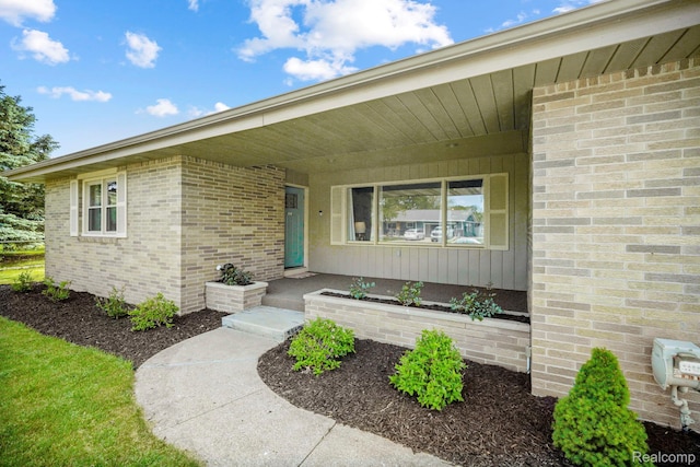 116 Surrey Rd, Saint Louis, MI 48880 - entrance to property featuring brick siding and covered porch