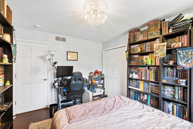 116 Surrey Rd, Saint Louis, MI 48880 - bedroom featuring a desk, wood finished floors, and a chandelier