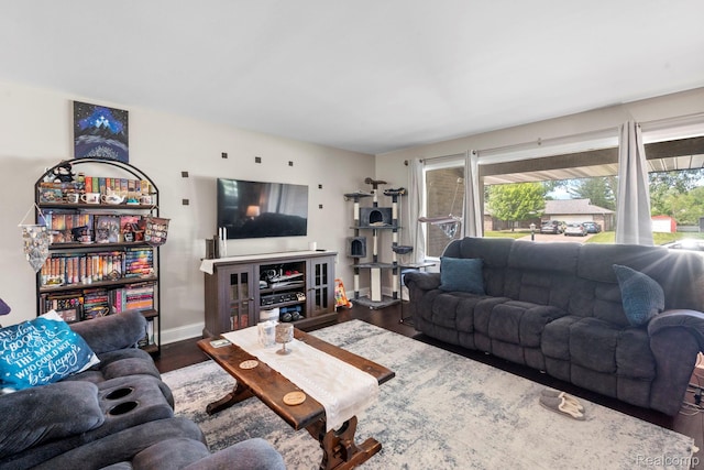 116 Surrey Rd, Saint Louis, MI 48880 - living area with plenty of natural light, wood finished floors, and baseboards