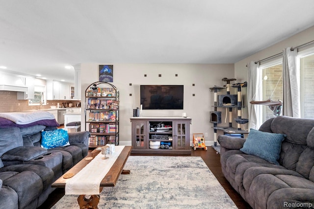 116 Surrey Rd, Saint Louis, MI 48880 - living area with baseboards and dark wood finished floors