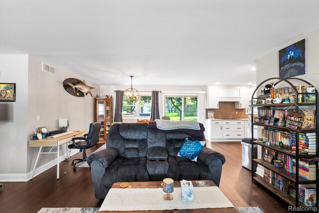 116 Surrey Rd, Saint Louis, MI 48880 - living area with wood finished floors and baseboards