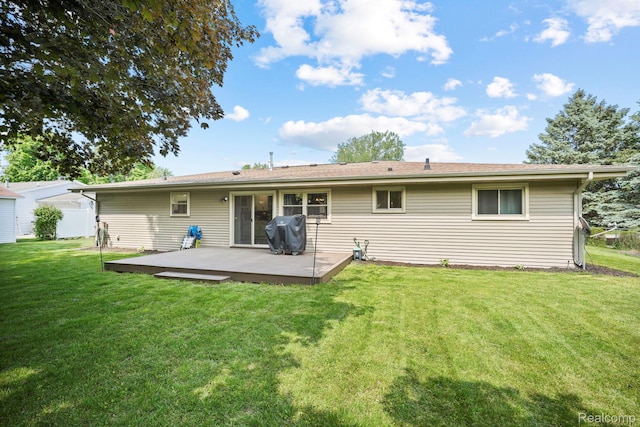 116 Surrey Rd, Saint Louis, MI 48880 - rear view of property featuring a lawn and a deck