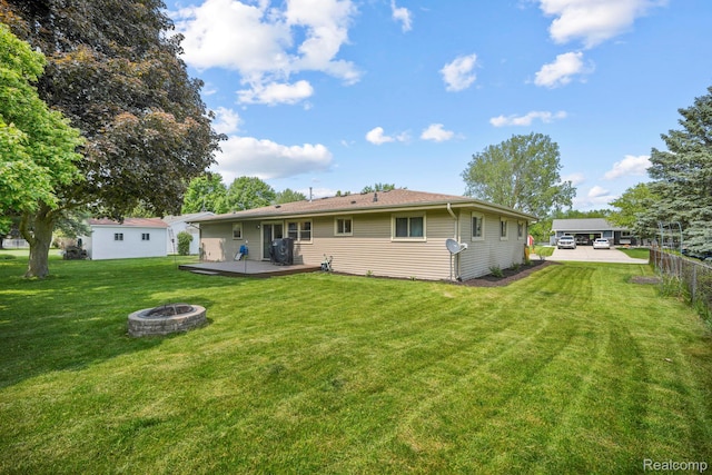 116 Surrey Rd, Saint Louis, MI 48880 - back of house featuring a fire pit