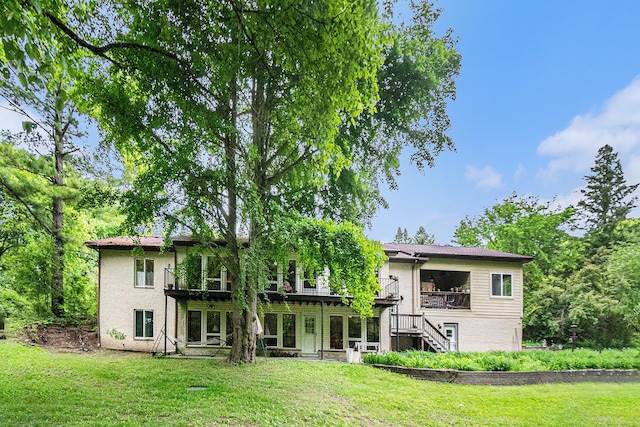 22649 N Dixboro Rd, South Lyon, MI 48178 - back of house featuring stairway, a lawn, and a deck