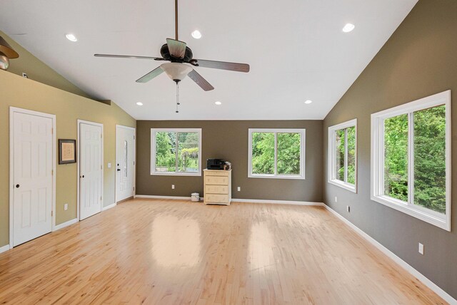 22649 N Dixboro Rd, South Lyon, MI 48178 - unfurnished living room with vaulted ceiling, light wood finished floors, a ceiling fan, baseboards, and recessed lighting