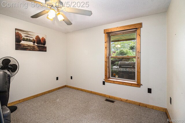 3275 Levalley Rd, Columbiaville, MI 48421 - unfurnished office featuring carpet floors, baseboards, and a ceiling fan