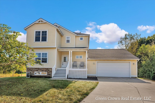 4052 Quest Ct SW, Wyoming, MI 49418 - traditional-style home featuring concrete driveway, covered porch, a garage, a front lawn, and stairs