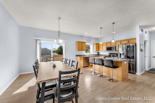 4052 Quest Ct SW, Wyoming, MI 49418 - dining area with light wood-style floors, baseboards, and recessed lighting