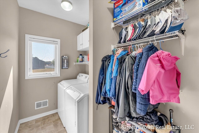 4052 Quest Ct SW, Wyoming, MI 49418 - laundry room featuring washer and clothes dryer, baseboards, and cabinet space