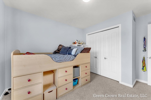 4052 Quest Ct SW, Wyoming, MI 49418 - bedroom with baseboards, carpet, and a closet