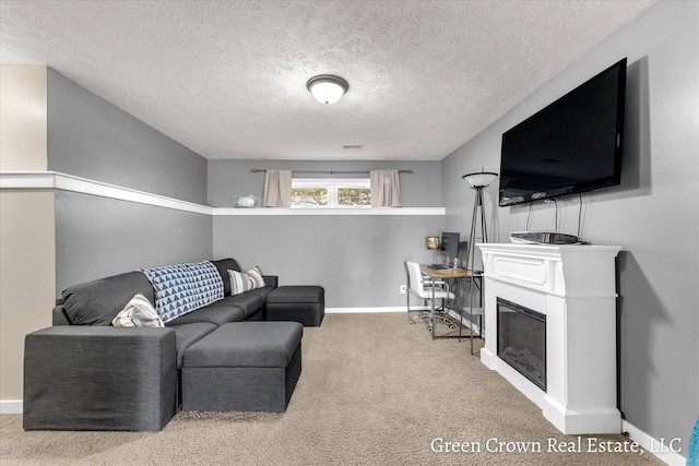 4052 Quest Ct SW, Wyoming, MI 49418 - living room featuring carpet floors, baseboards, a glass covered fireplace, and a textured ceiling