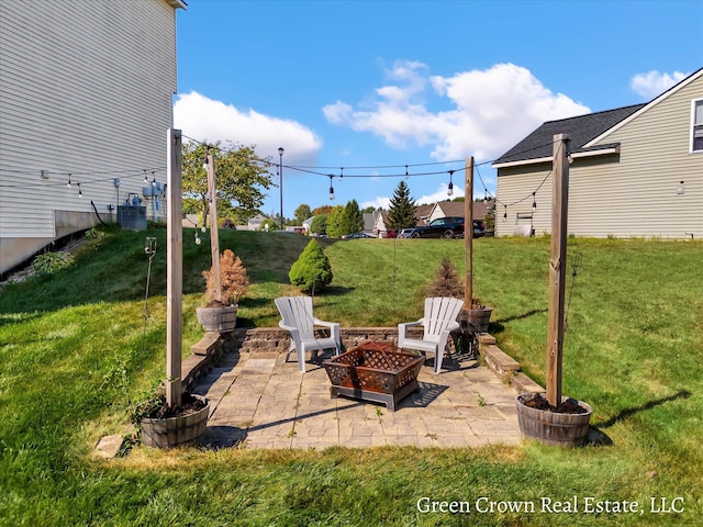 4052 Quest Ct SW, Wyoming, MI 49418 - view of patio featuring an outdoor fire pit