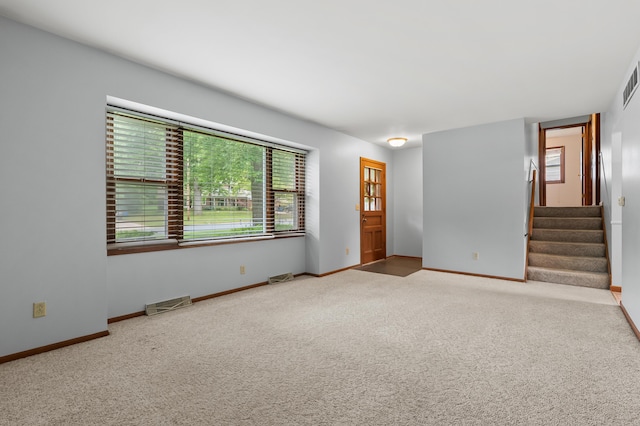 4564 Sparrow Ave, Kalamazoo, MI 49004 - carpeted entryway with stairway and baseboards