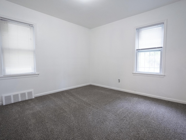 18350 Codding St, Detroit, MI 48219 - spare room featuring dark carpet and baseboards