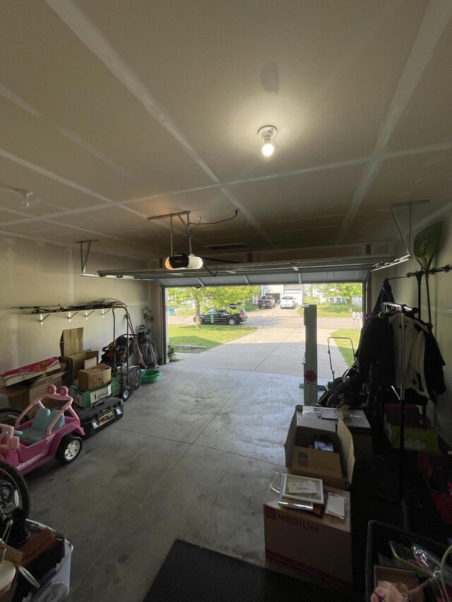 8808 Geiser Grv, Richland, MI 49083 - garage featuring a garage door opener