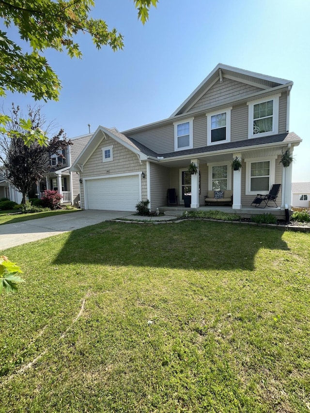 8808 Geiser Grv, Richland, MI 49083 - view of front of property with a garage, concrete driveway, covered porch, and a front lawn