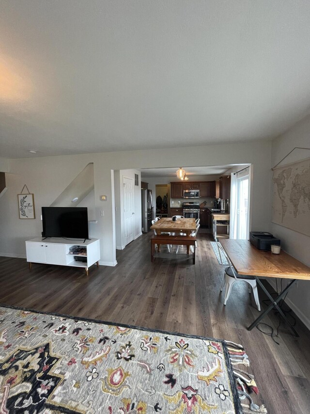 8808 Geiser Grv, Richland, MI 49083 - dining area with dark wood-style flooring and baseboards
