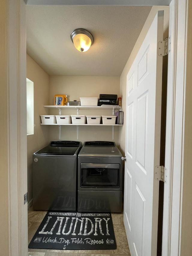 8808 Geiser Grv, Richland, MI 49083 - laundry area with washer and dryer and tile patterned floors