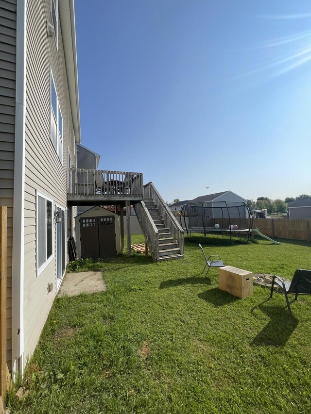 8808 Geiser Grv, Richland, MI 49083 - view of yard with a trampoline, stairs, and a wooden deck