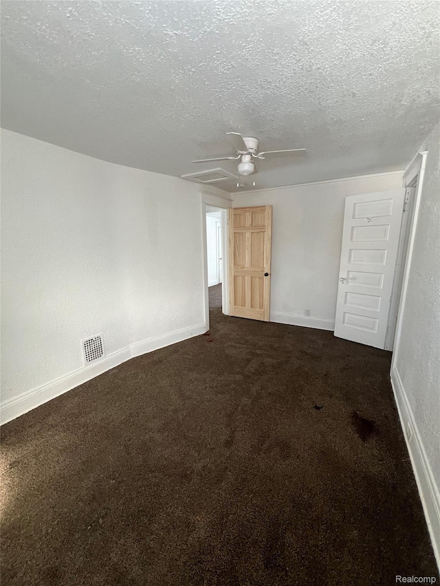 3137 S Washington Ave, Saginaw, MI 48601 - unfurnished room with a textured ceiling, a ceiling fan, dark colored carpet, and baseboards