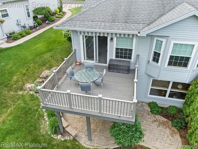 2336 Swans Cv Unit 7, Fenton, MI 48430 - deck featuring a yard