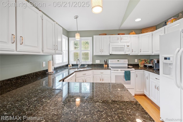 2336 Swans Cv Unit 7, Fenton, MI 48430 - kitchen featuring white appliances, white cabinets, recessed lighting, dark stone counters, and hanging light fixtures