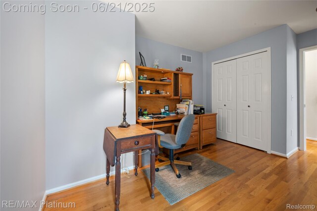 2336 Swans Cv Unit 7, Fenton, MI 48430 - home office with light wood-style flooring and baseboards