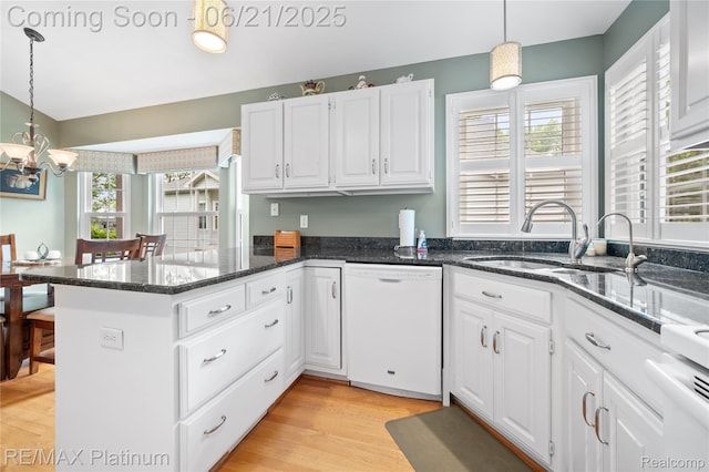 2336 Swans Cv Unit 7, Fenton, MI 48430 - kitchen featuring dishwasher, a peninsula, white cabinetry, a chandelier, and light wood-style floors