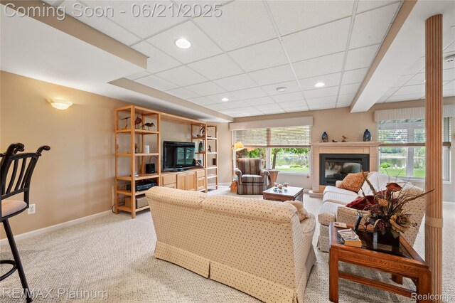2336 Swans Cv Unit 7, Fenton, MI 48430 - living room featuring light carpet, a paneled ceiling, a glass covered fireplace, and recessed lighting