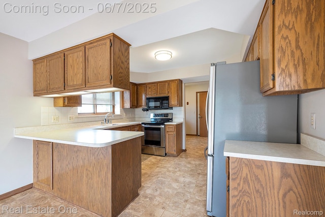 16256 Karen Dr, Clinton Township, MI 48038 - kitchen with stainless steel appliances, a peninsula, tasteful backsplash, brown cabinets, and light countertops