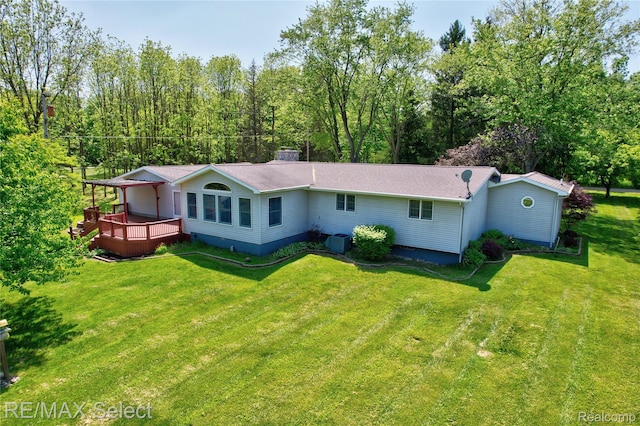 2391 Atwell Rd, Attica, MI 48412 - back of house with a wooden deck, a lawn, and cooling unit