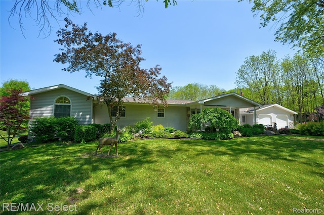 2391 Atwell Rd, Attica, MI 48412 - view of front facade with a front lawn and an attached garage