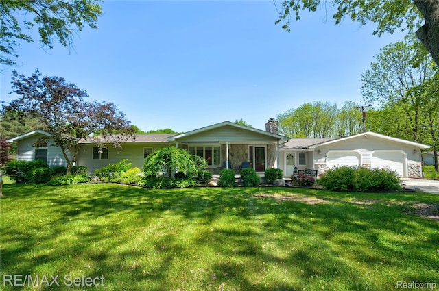 2391 Atwell Rd, Attica, MI 48412 - single story home with a chimney, an attached garage, a front lawn, stone siding, and driveway