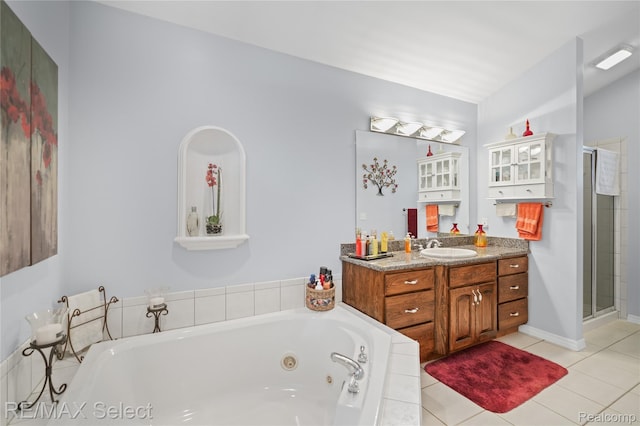 2391 Atwell Rd, Attica, MI 48412 - full bathroom with vanity, a tub with jets, a shower stall, and tile patterned floors