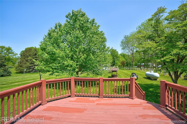 2391 Atwell Rd, Attica, MI 48412 - wooden deck with a yard and view of wooded area
