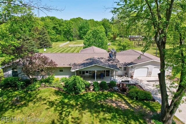 2391 Atwell Rd, Attica, MI 48412 - view of front of house featuring a front yard and a garage