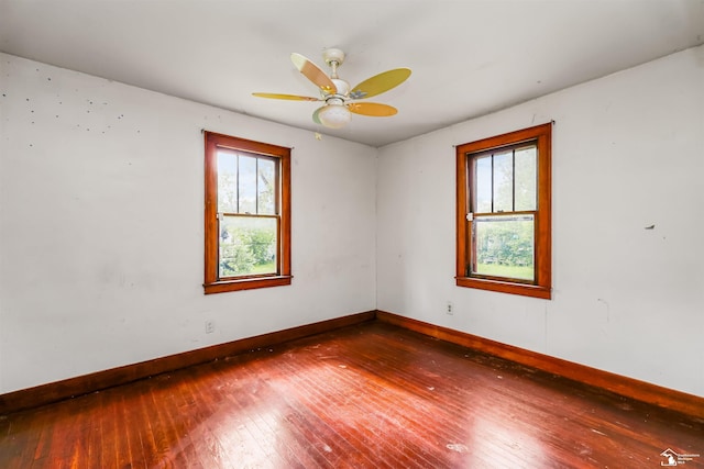 5650 Sylvia St, Dearborn Heights, MI 48125 - empty room featuring hardwood / wood-style flooring, healthy amount of natural light, and a ceiling fan