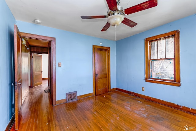 5650 Sylvia St, Dearborn Heights, MI 48125 - unfurnished bedroom with baseboards and wood-type flooring