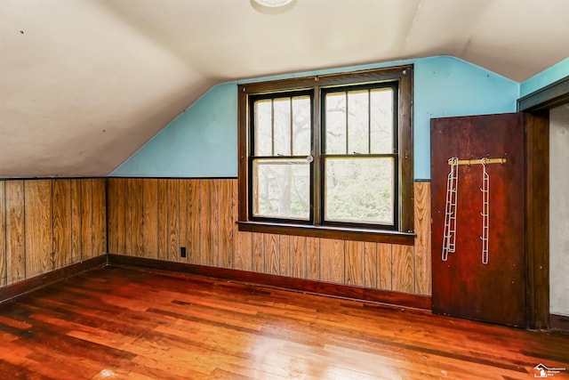 5650 Sylvia St, Dearborn Heights, MI 48125 - additional living space with lofted ceiling, wood finished floors, wood walls, and wainscoting