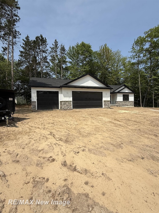 3706 Bobcat Ct, Midland, MI 48642 - view of front facade with stone siding