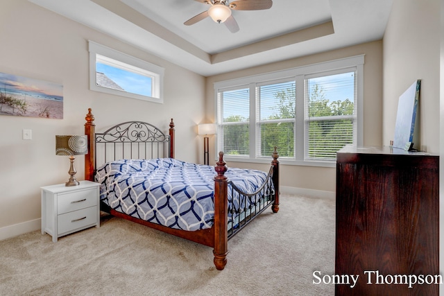 3912 Preserve Dr NE Unit 44, Belmont, MI 49306 - bedroom featuring light carpet, baseboards, a ceiling fan, and a raised ceiling